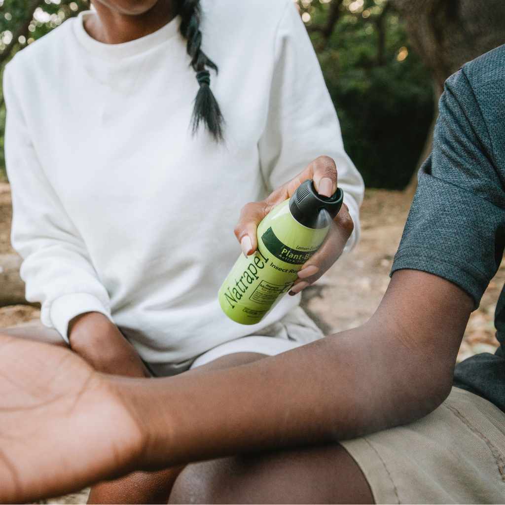 Natrapel Lemon Eucalyptus Tick & Insect Repellent Eco-Spray 6 oz. woman spraying on child's arm