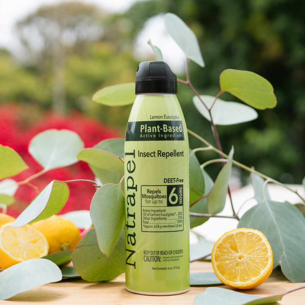 Natrapel Lemon Eucalyptus Tick & Insect Repellent Eco-Spray 6 oz. posed in front of lemon and eucalyptus