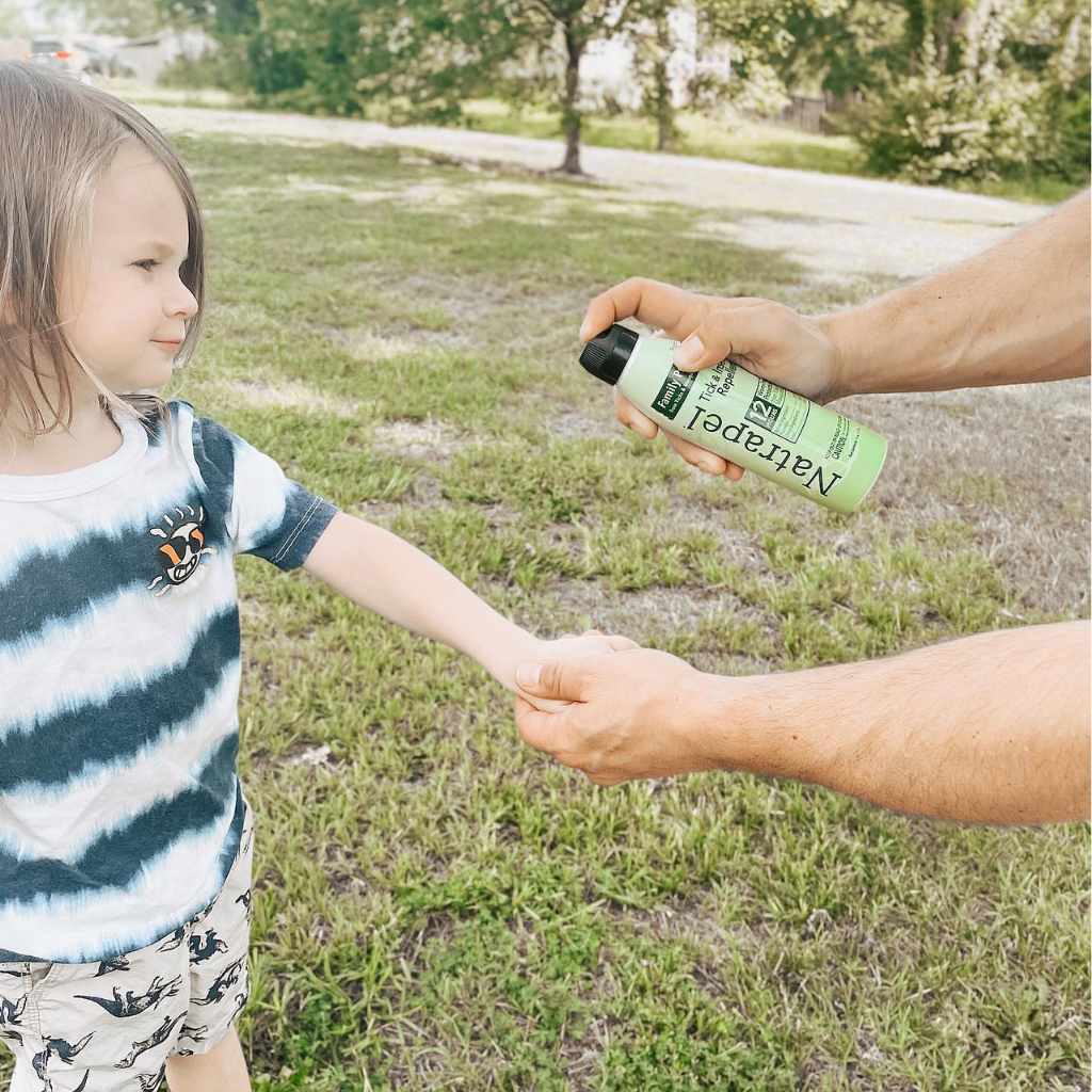 Natrapel Picaridin Tick & Insect Repellent Eco-Spray 6 oz. person spraying on child's arm