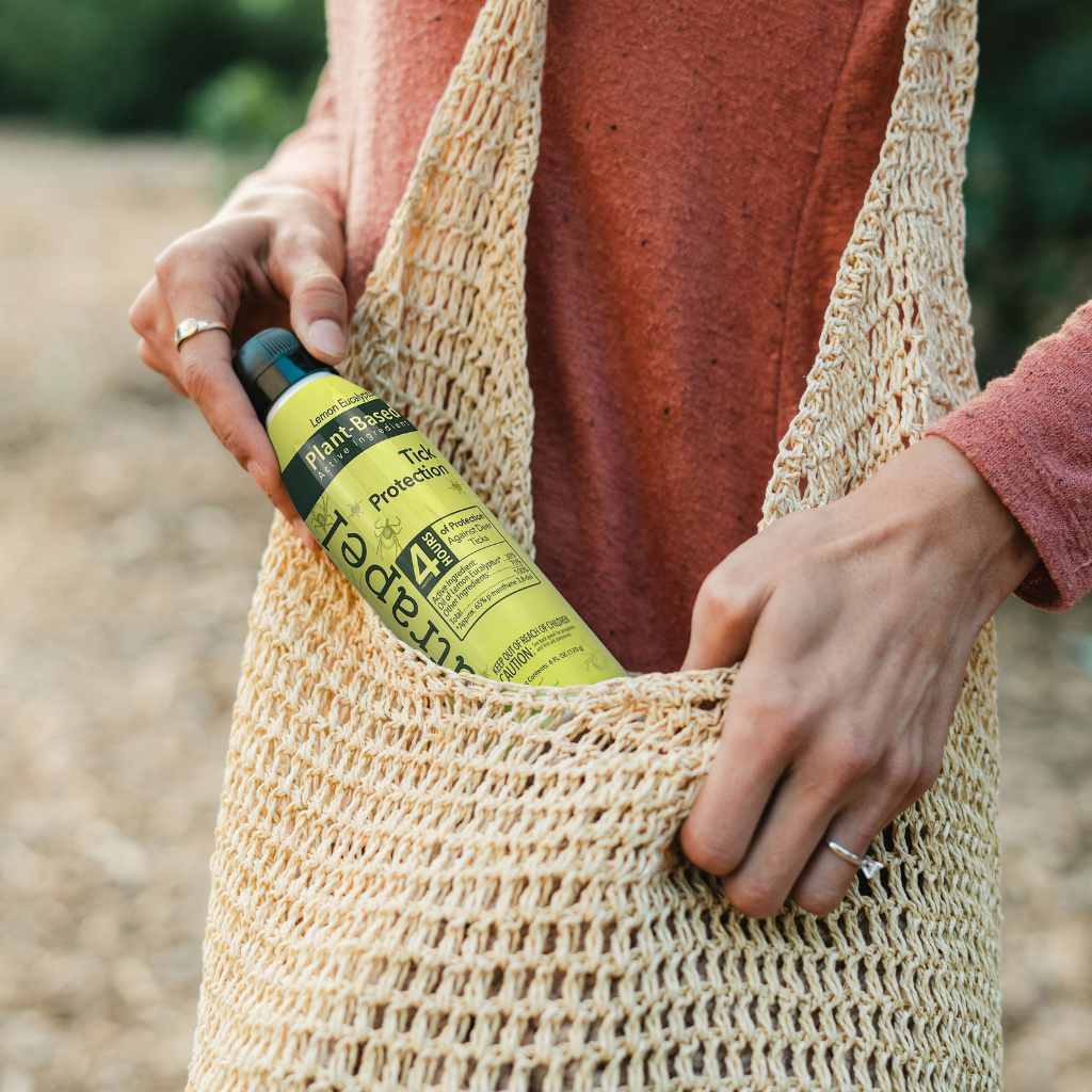 Natrapel Lemon Eucalyptus Tick Repellent Eco-Spray 6 oz. woman pulling from raffia bag