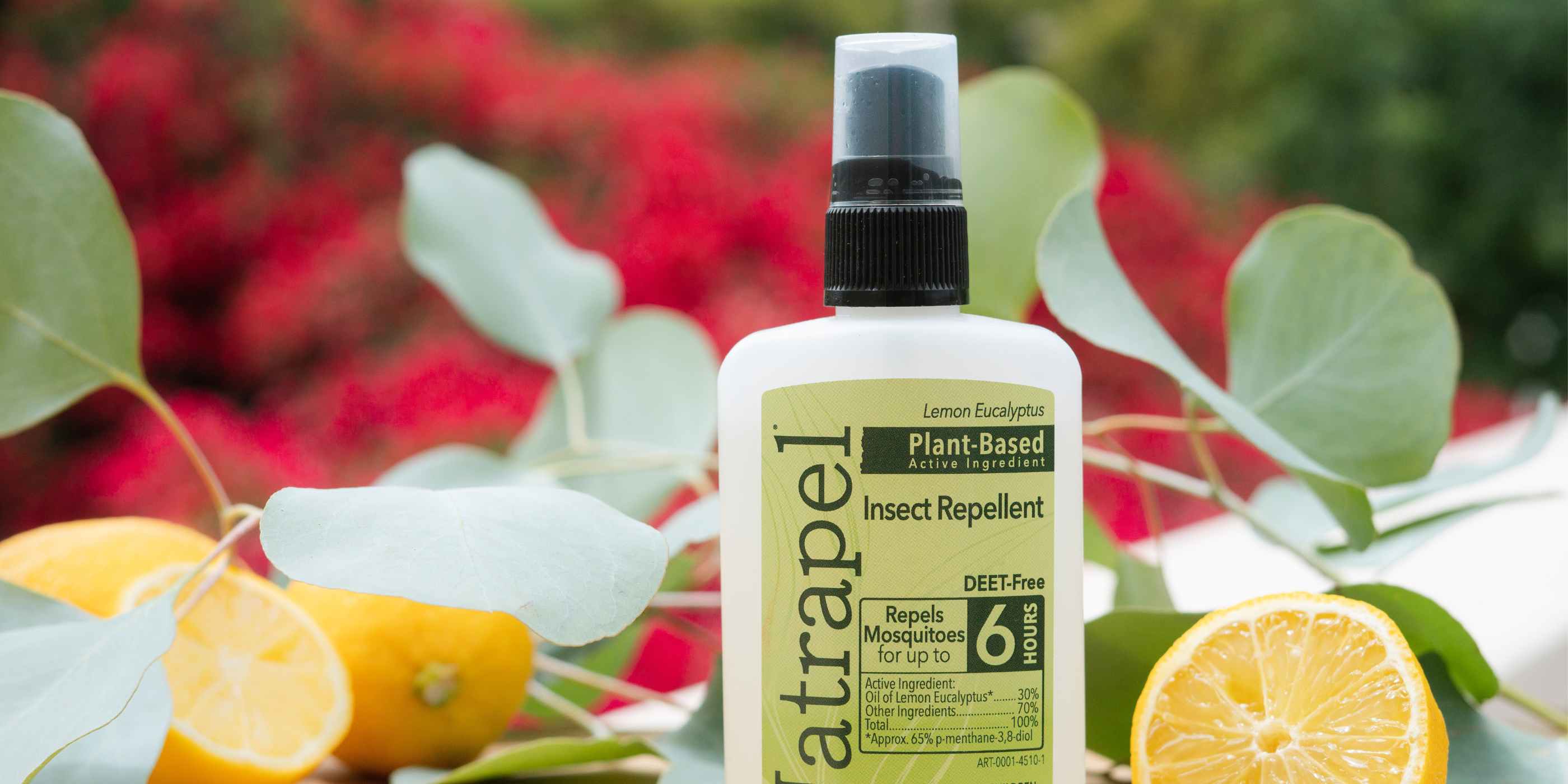 Natrapel Lemon Eucalyptus Plant Based Insect Repellent placed in front of lemons and eucalyptus leaves