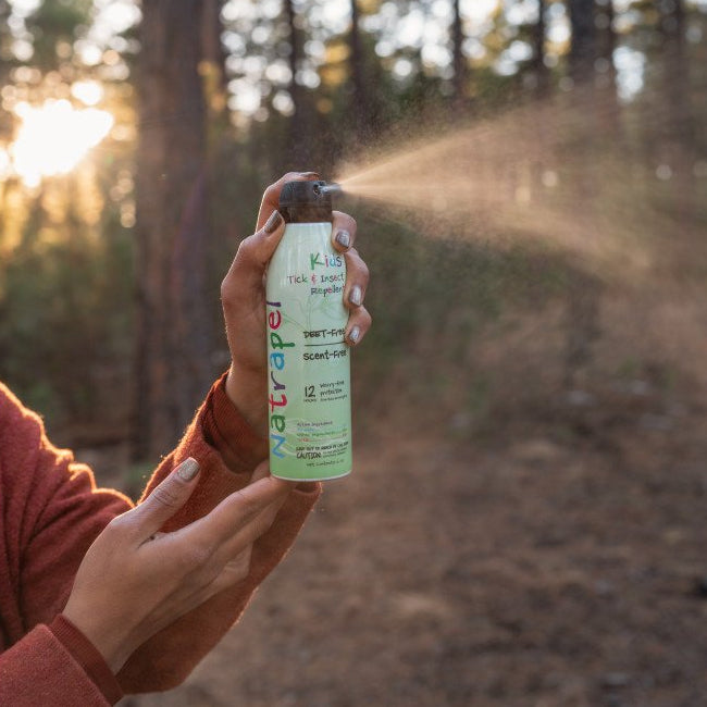 6oz insect repellent can being sprayed